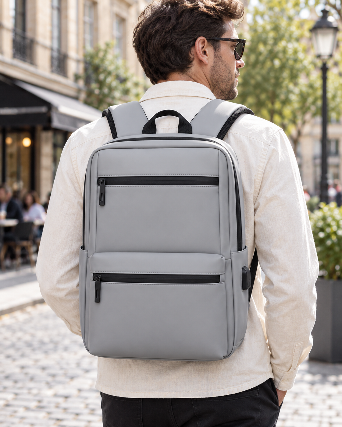 Minimalistički pravokutni ruksak s PU premazom — AI lifestyle ilustracija s osobom